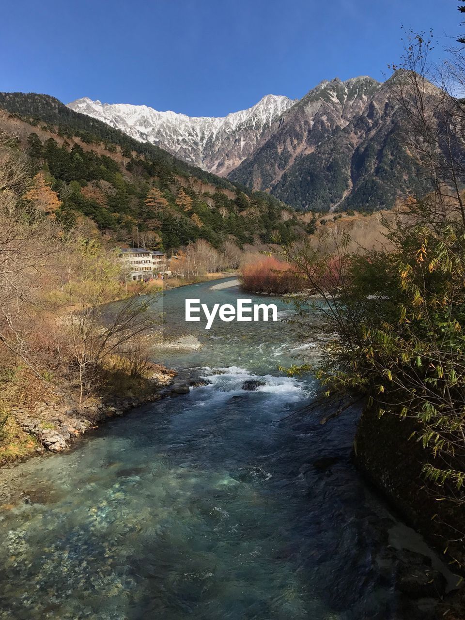 SCENIC VIEW OF MOUNTAINS AND LAKE