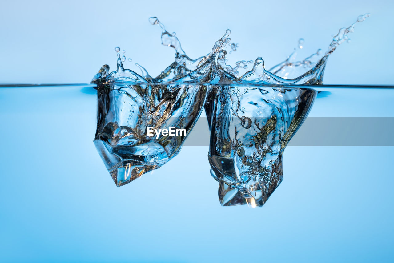 CLOSE-UP OF ICE CUBES IN WATER