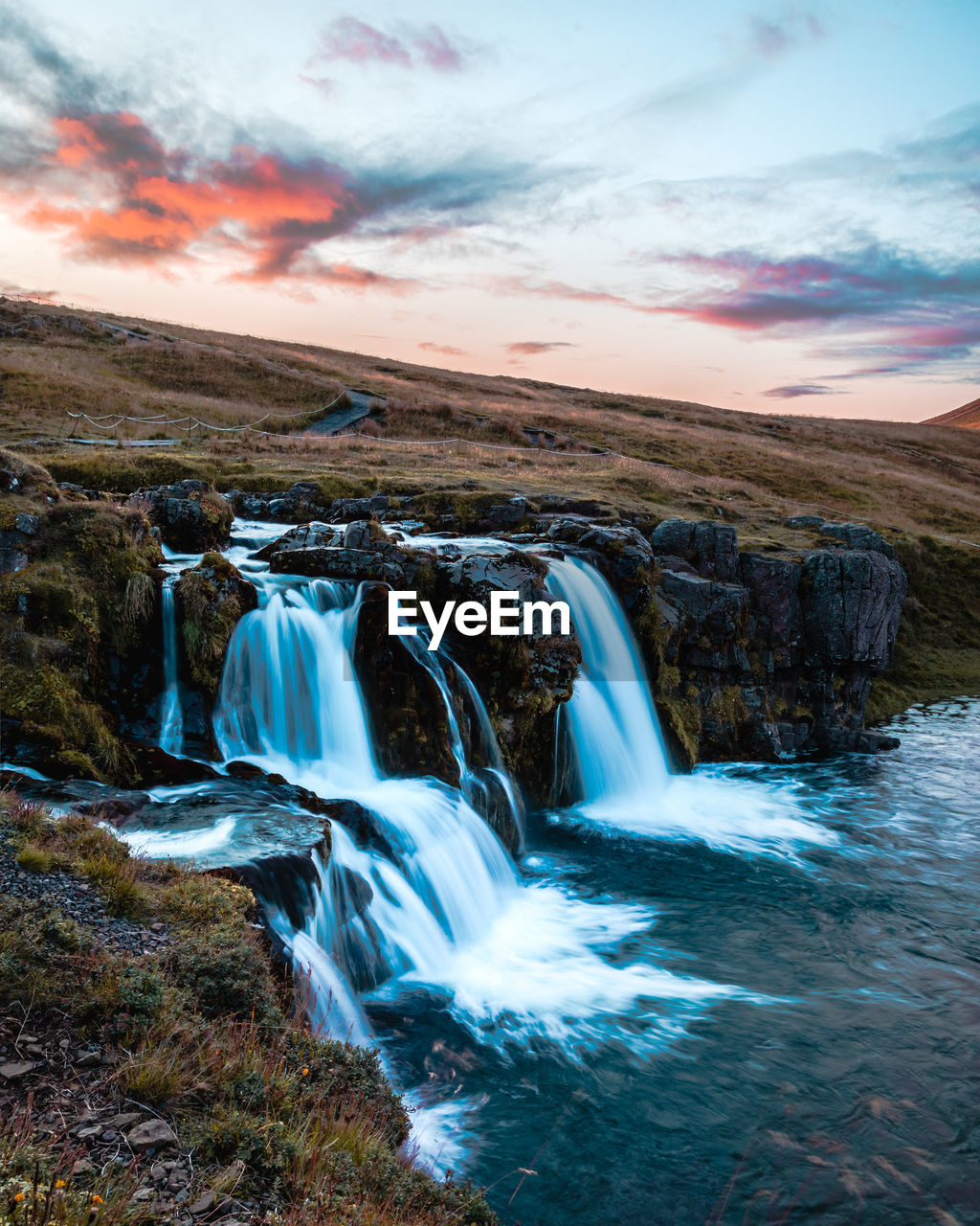 SCENIC VIEW OF WATERFALL