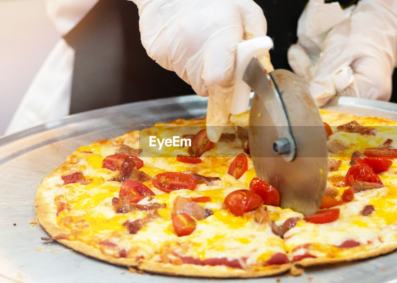 cropped hand of person preparing food