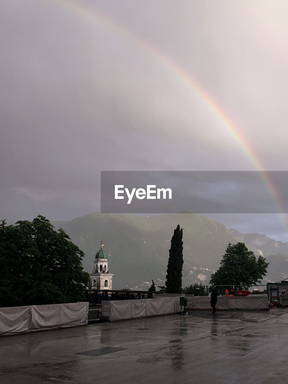 Scenic view of rainbow over mountain against sky