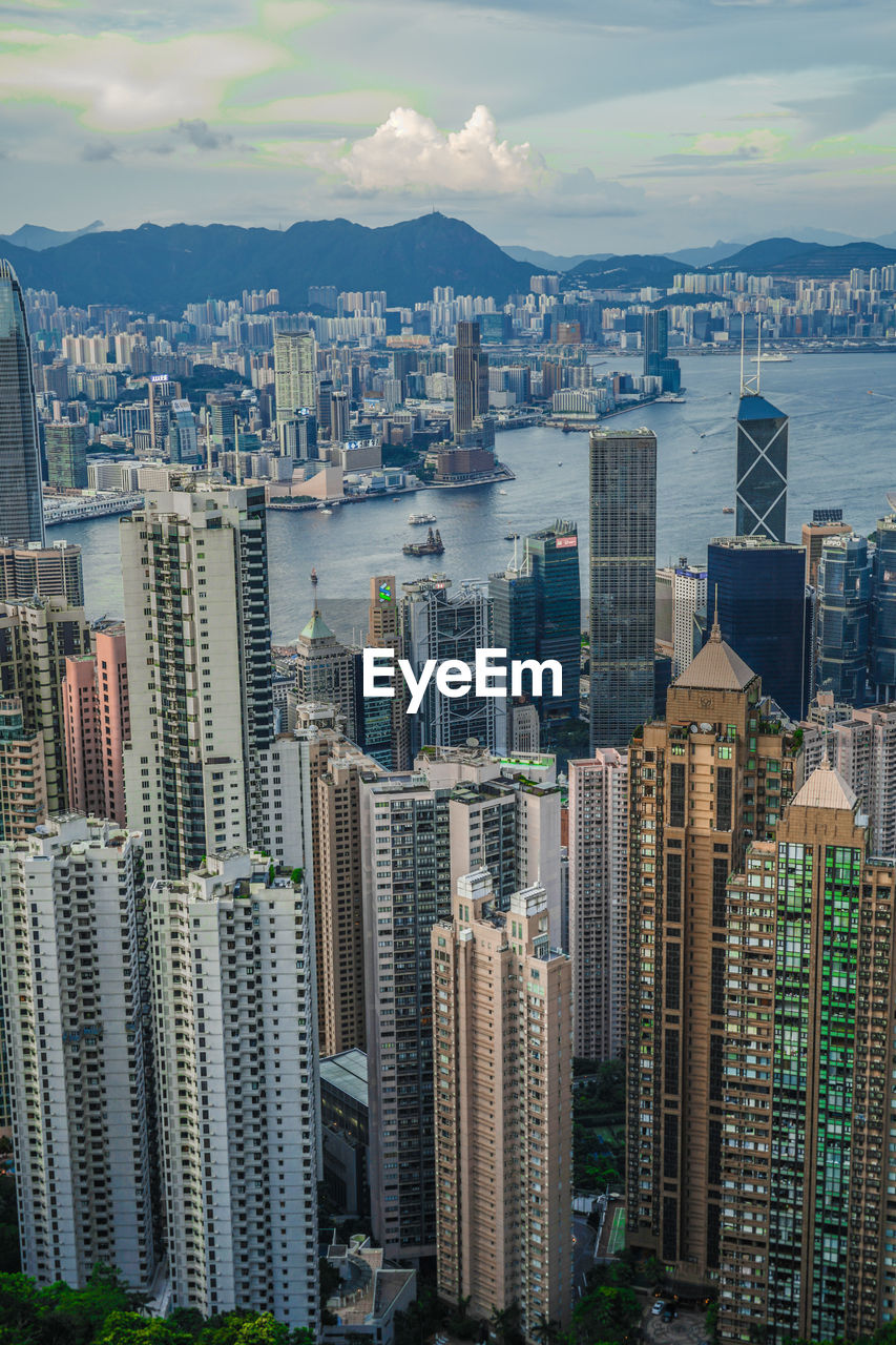 HIGH ANGLE VIEW OF BUILDINGS AGAINST SKY