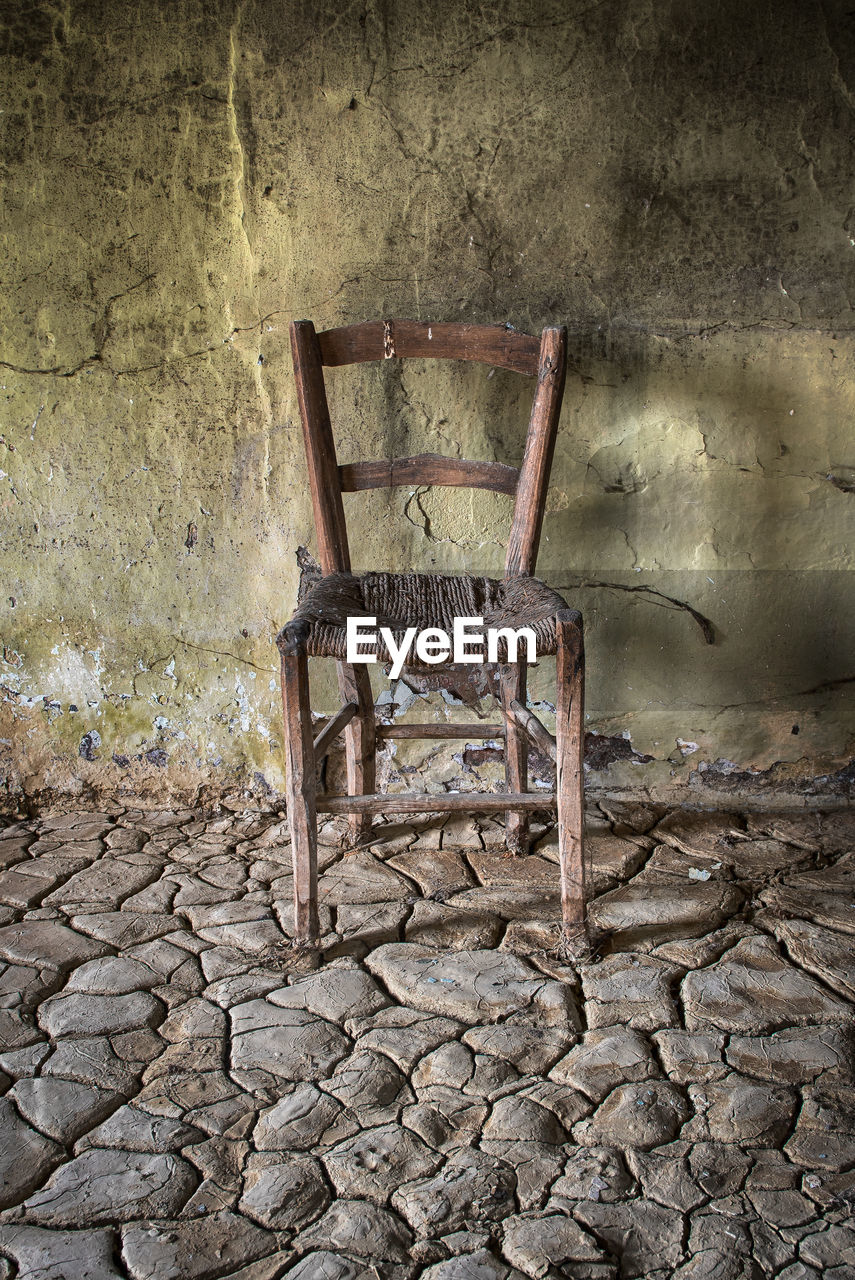 ABANDONED CHAIR IN ROOM