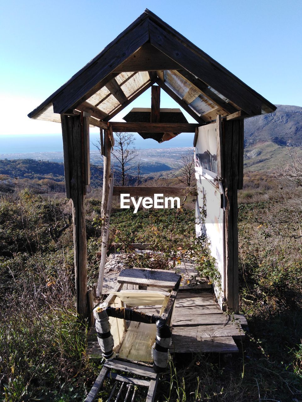 View of old ruin on field against sky