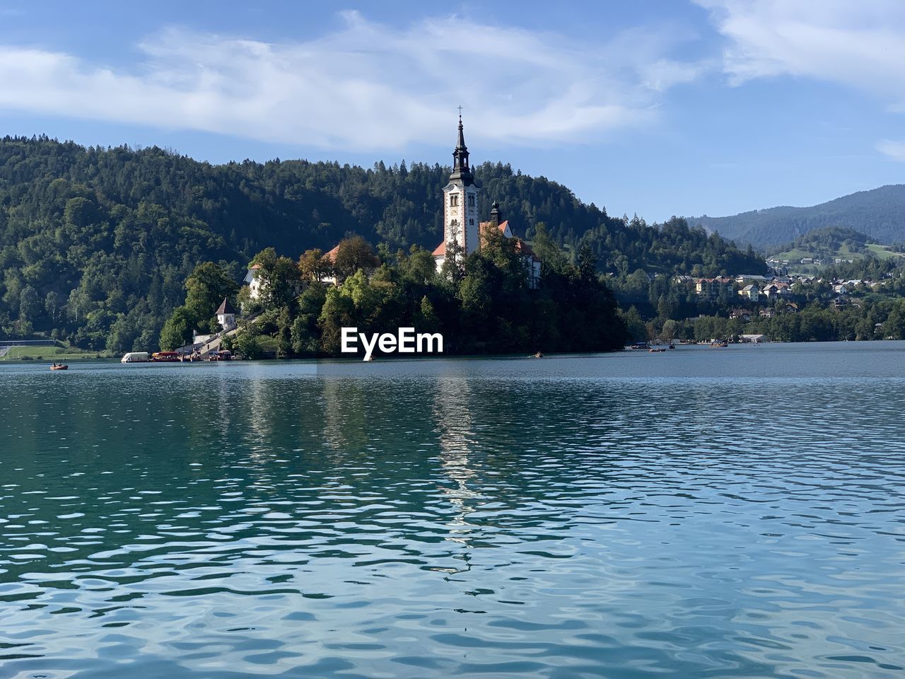 Church of the assumtion island seen in a perfect summer day on lake bled, slovenia