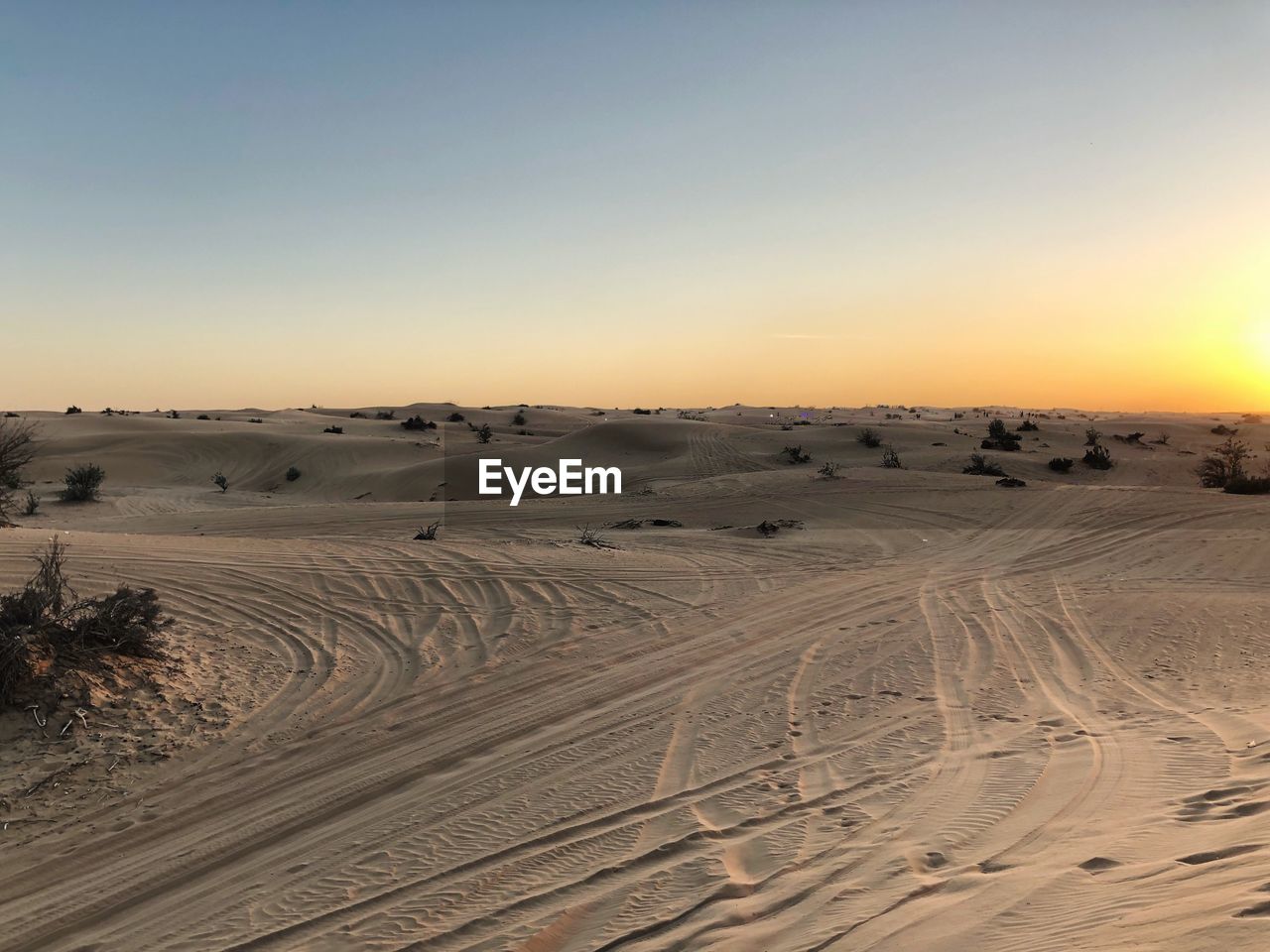 Scenic view of desert against clear sky