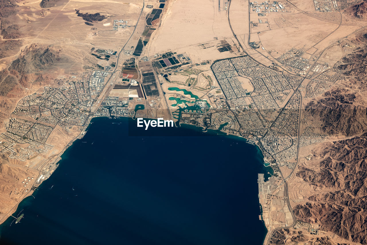 High angle view of airplane flying over land