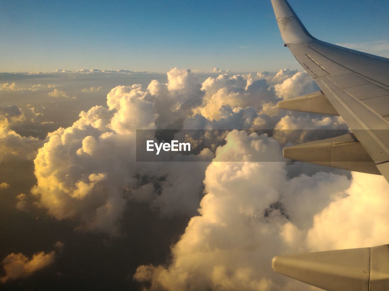AERIAL VIEW OF CLOUDS OVER AIRPLANE