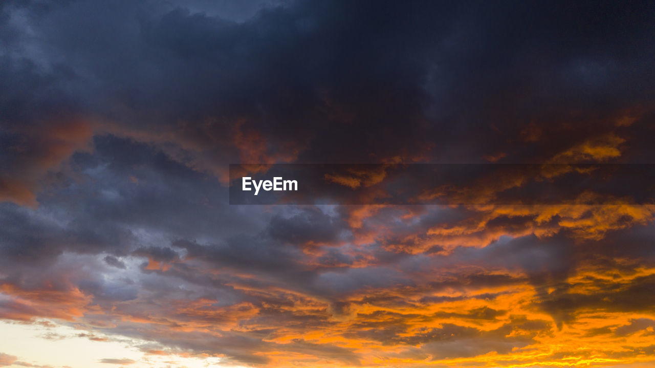 LOW ANGLE VIEW OF CLOUDY SKY DURING SUNSET