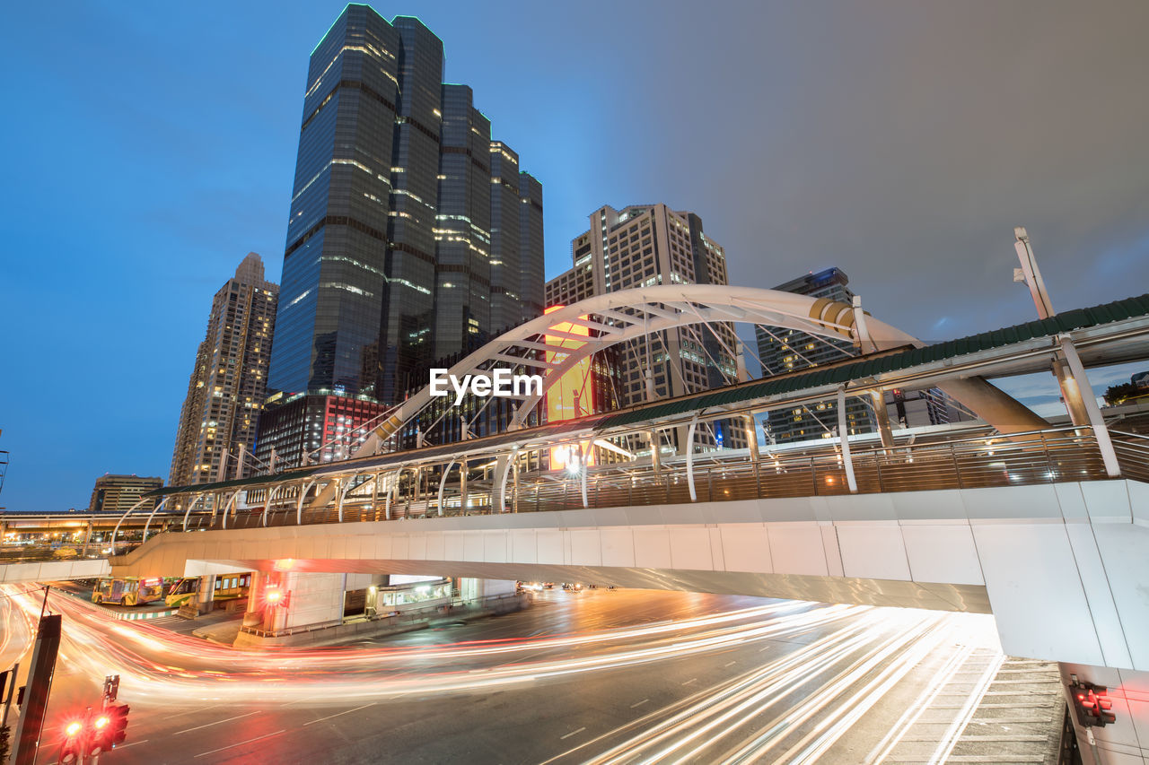 LOW ANGLE VIEW OF ILLUMINATED MODERN BUILDINGS AGAINST SKY