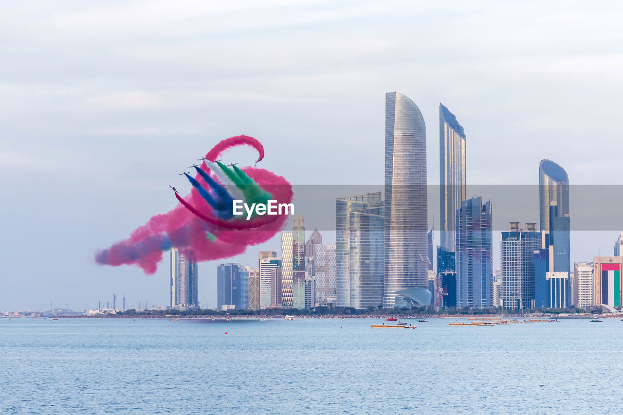 Al fursan aerobatic team doing stunts in the sky in abu dhabi, uae for national day celebrations