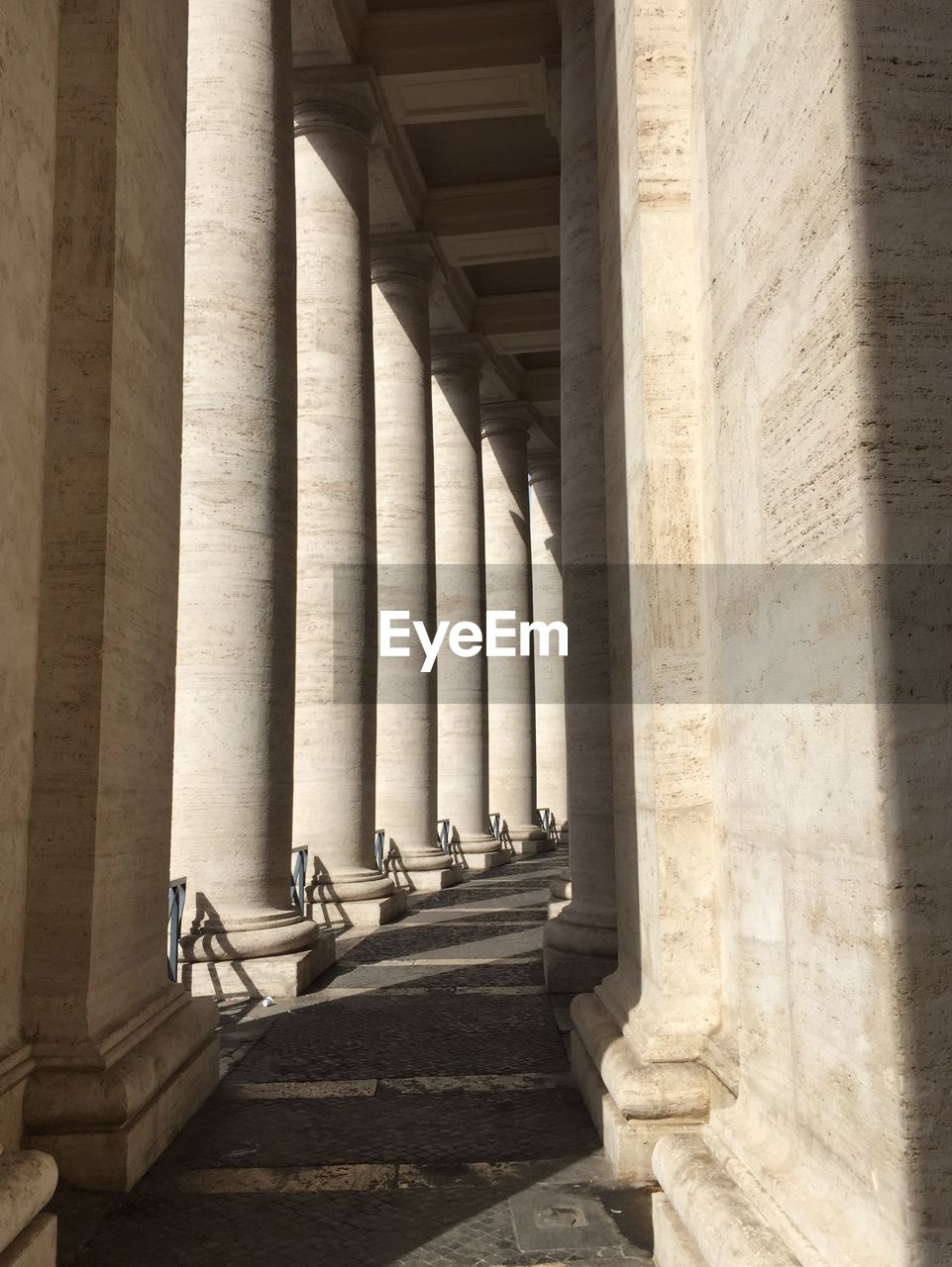 VIEW OF COLONNADE AND BUILDING