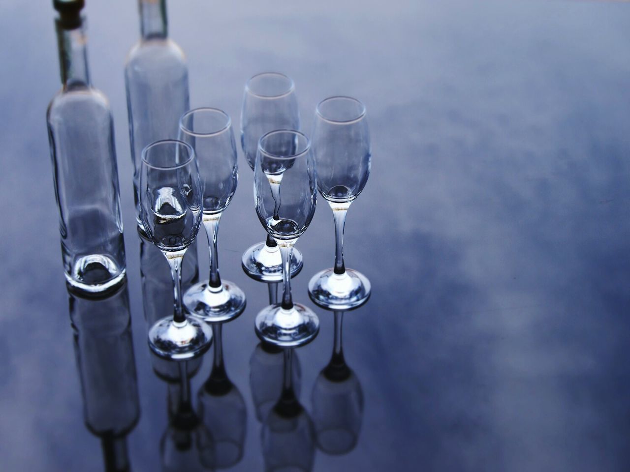 Empty champagne flutes on table