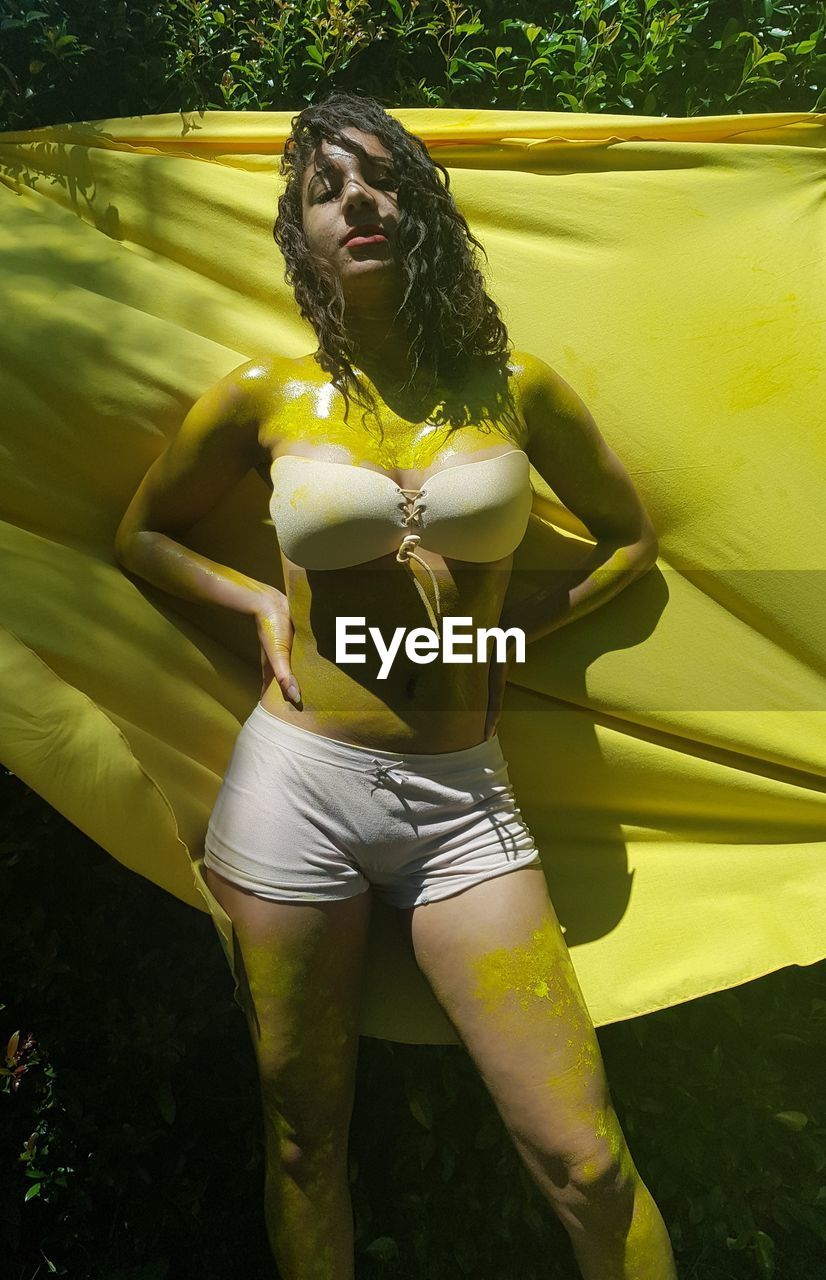 New dawn visions productions on the body paint theme photo shoot with her colour yellow.