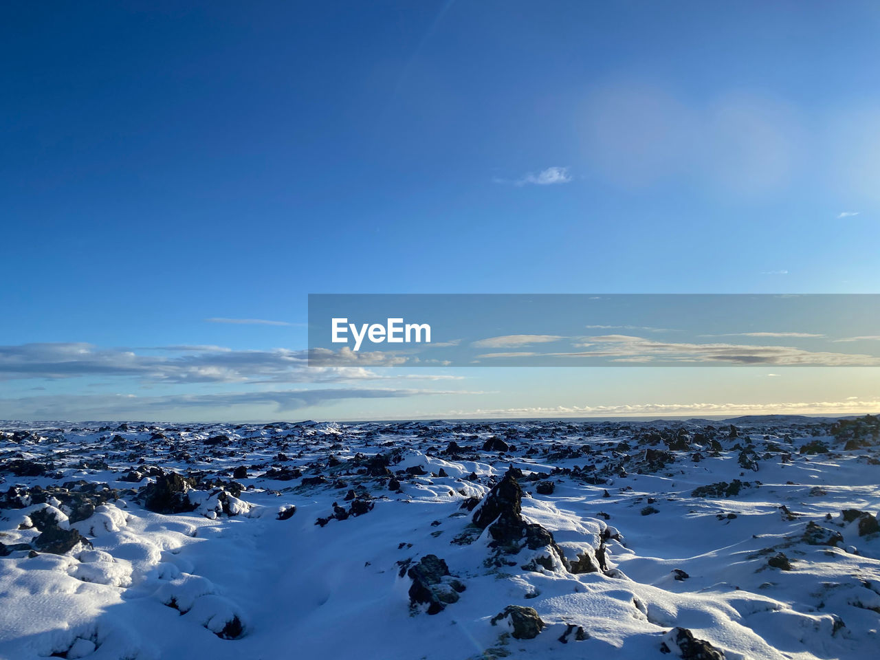 Scenic view of sea against sky during winter
