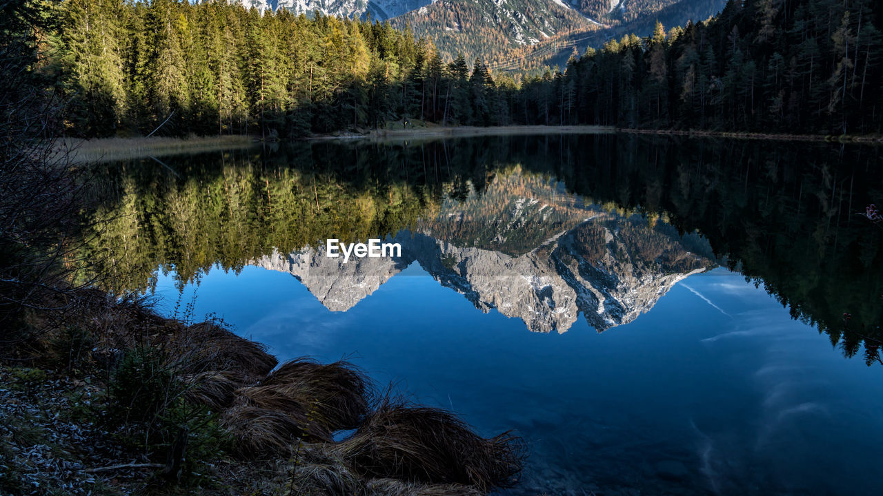 Reflection of sonnenspitze and marienbergspitzen in mitersee