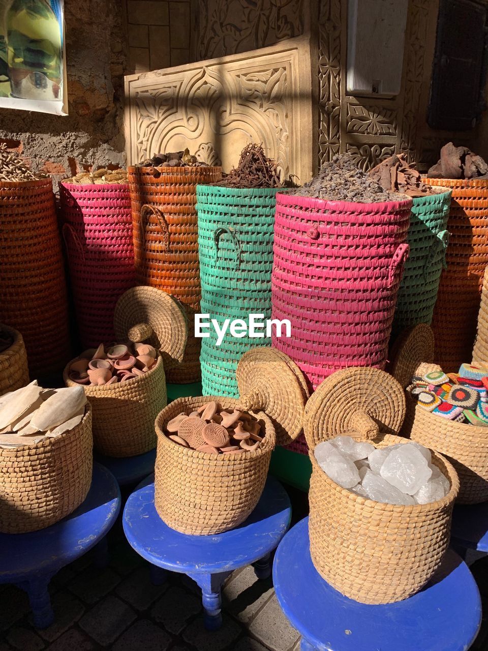Various objects in baskets for sale at market stall