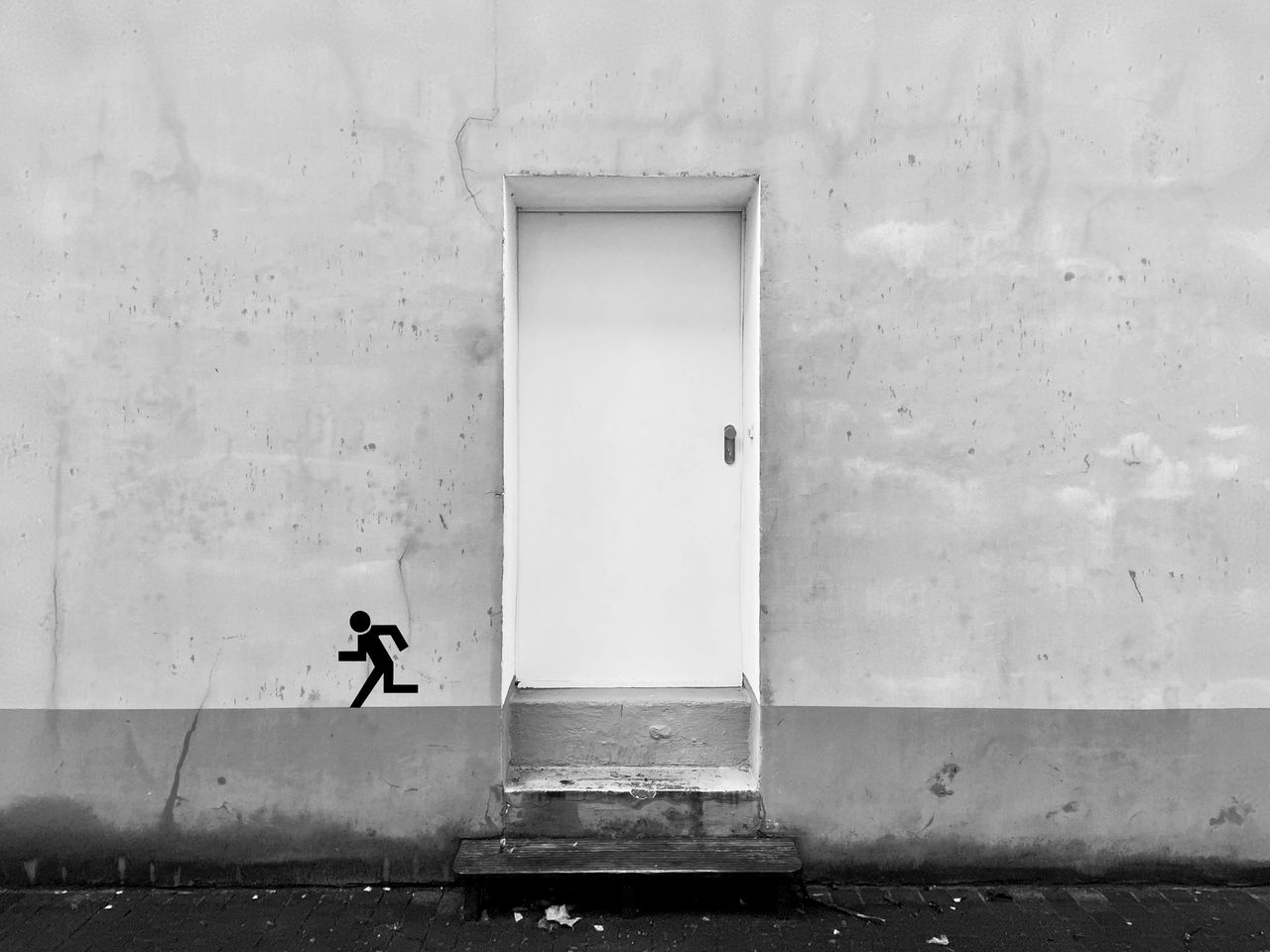 Man walking in front of building