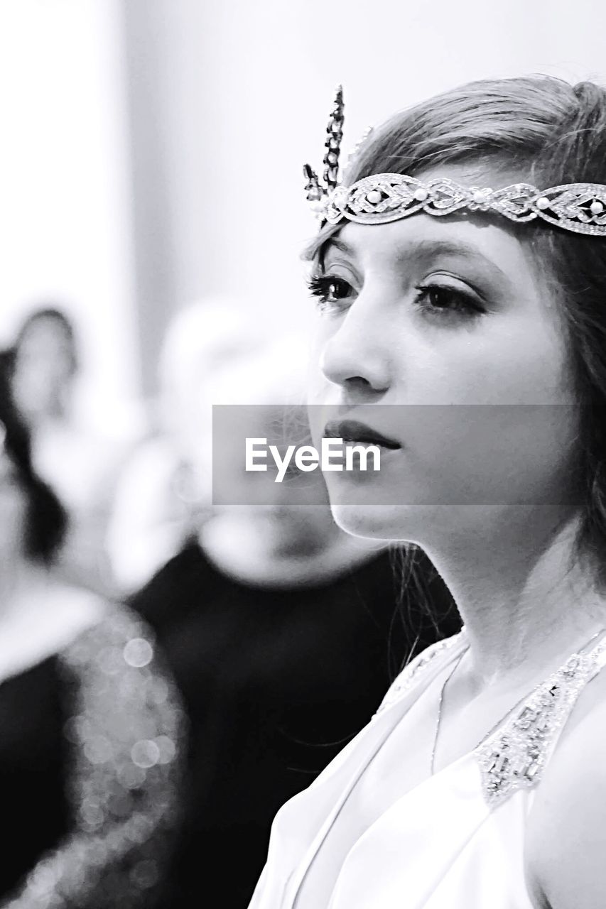 Close-up of beautiful bride looking away