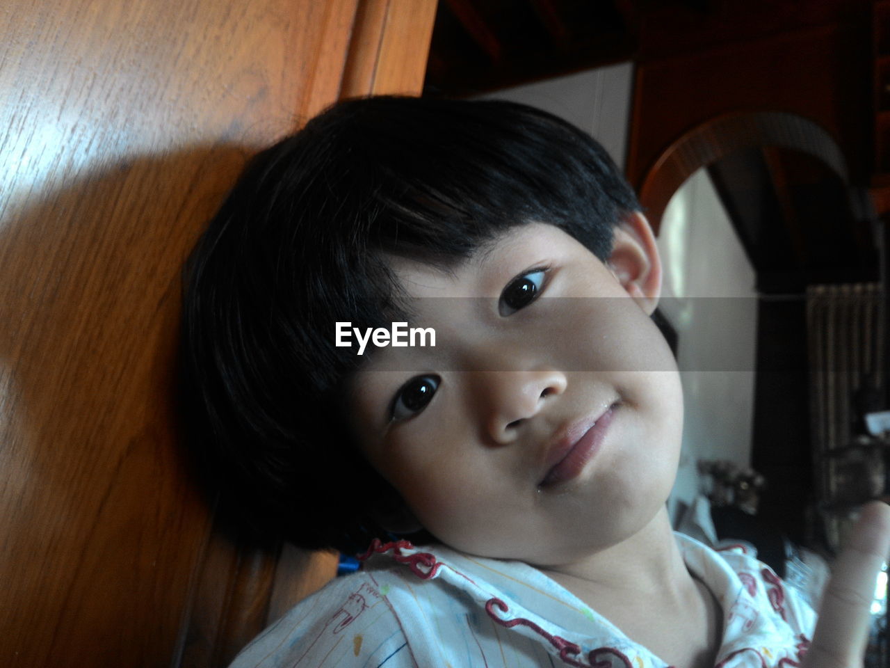 CLOSE-UP PORTRAIT OF CUTE BABY AT HOME