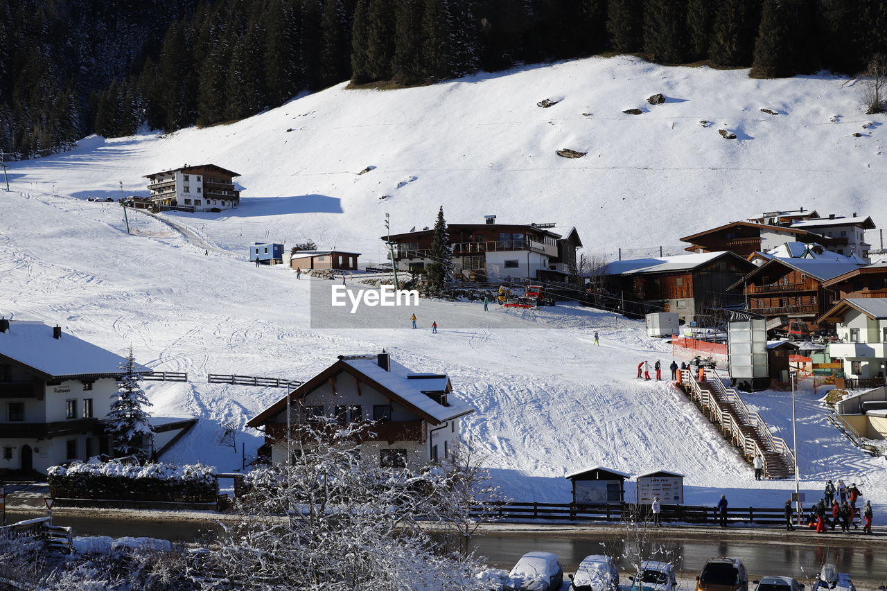 High angle view of snow covered houses in village