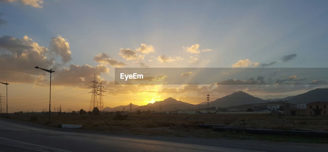 ROAD AGAINST SKY AT SUNSET