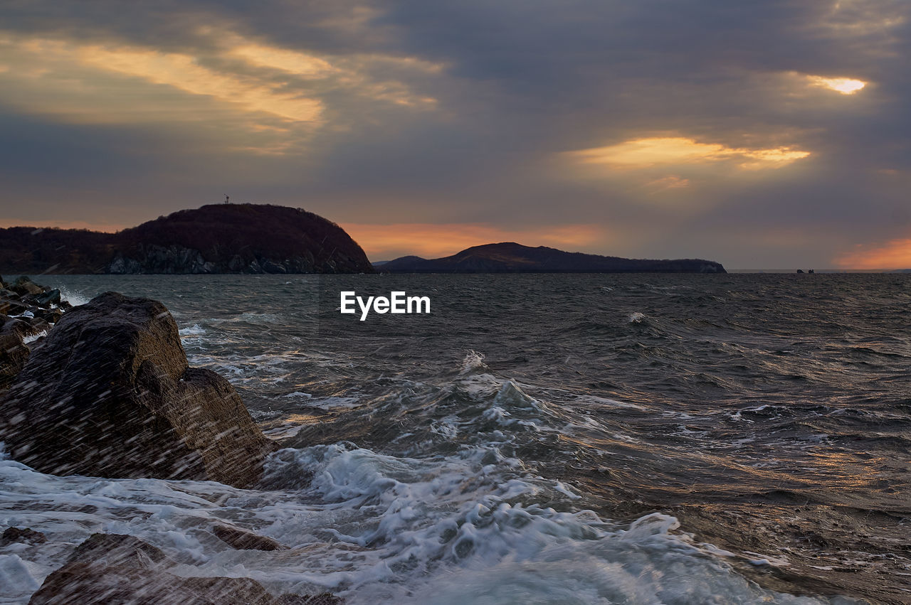 Scenic view of sea against sky during sunset