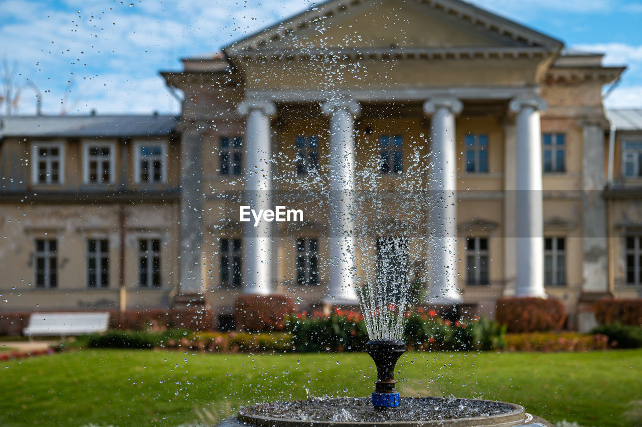 Krimulda manor or castle and garden with a fountain in the gauja national park near sigulda, latvia