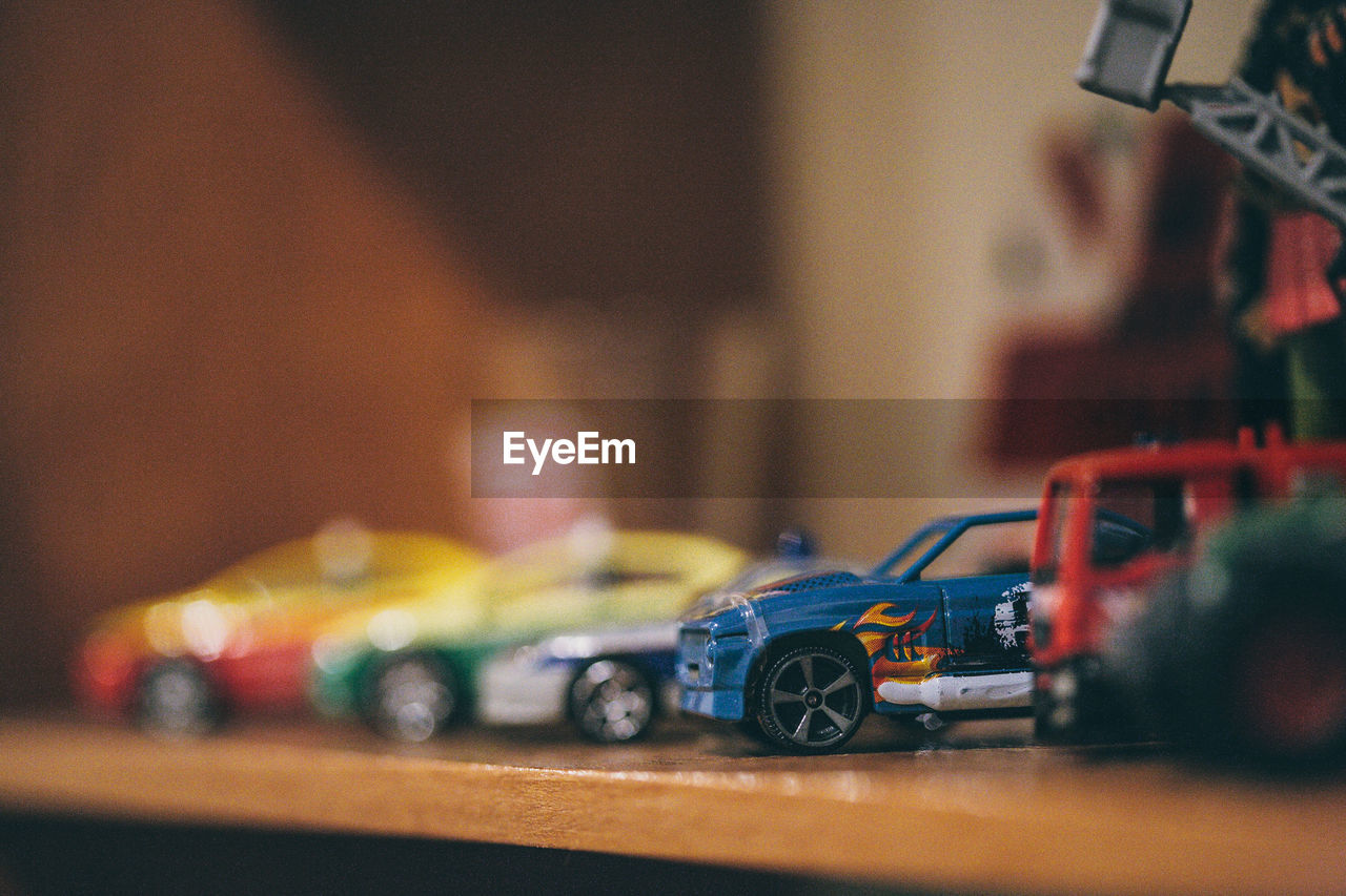 CLOSE-UP OF MULTI COLORED TABLE IN CAR