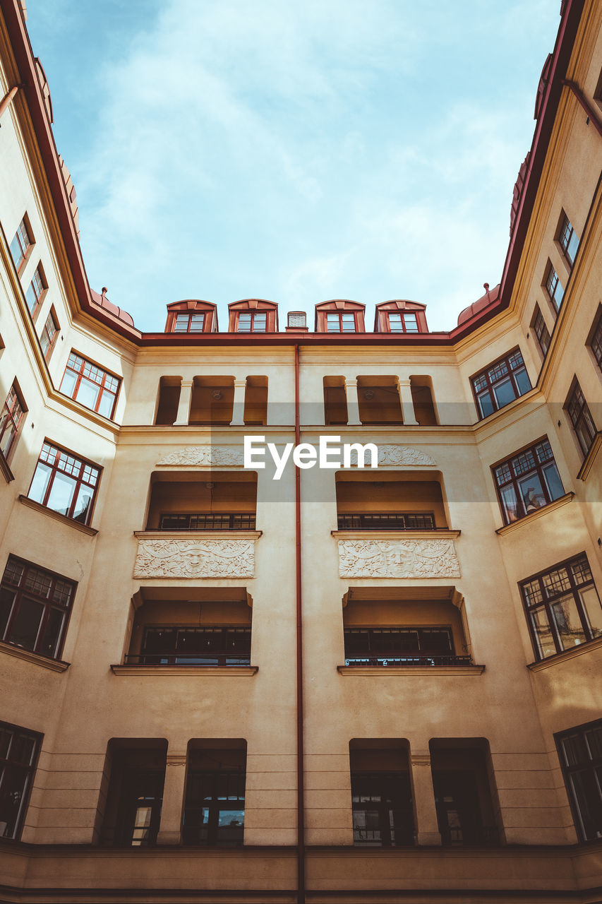 LOW ANGLE VIEW OF RESIDENTIAL BUILDINGS AGAINST SKY