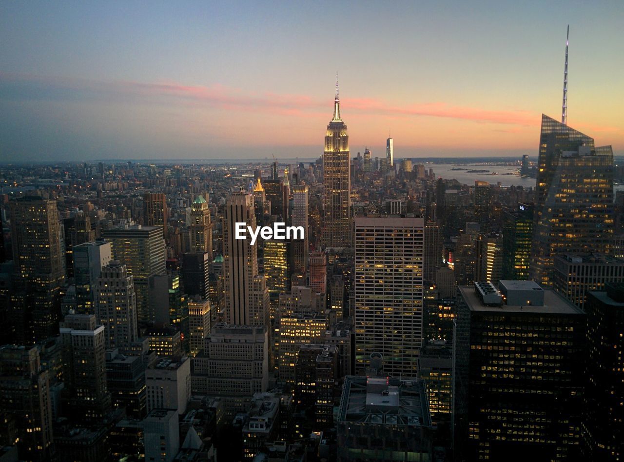 High angle view of illuminated cityscape at dusk