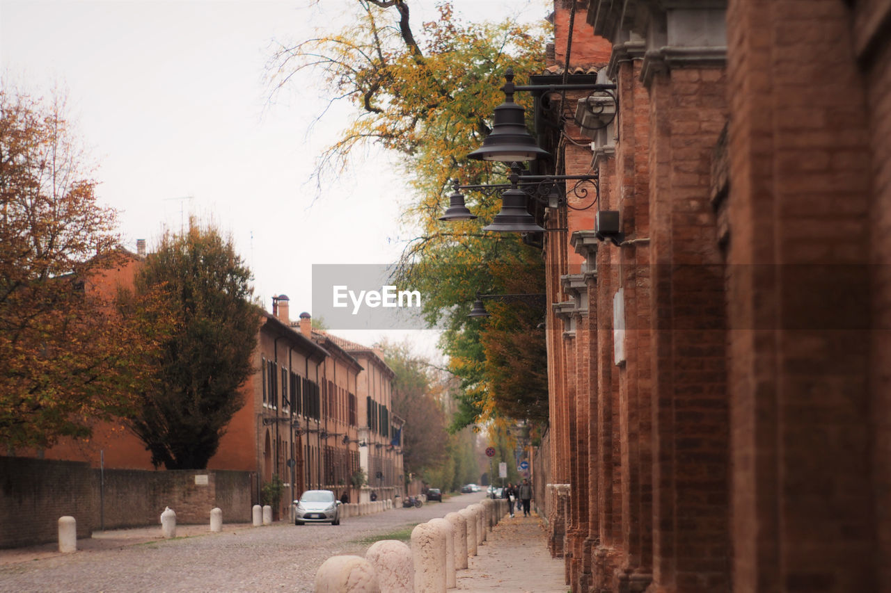 STREET AMIDST BUILDINGS IN CITY