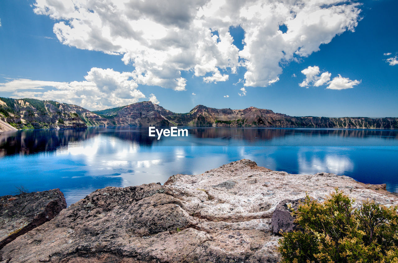 Scenic view of lake against mountain range