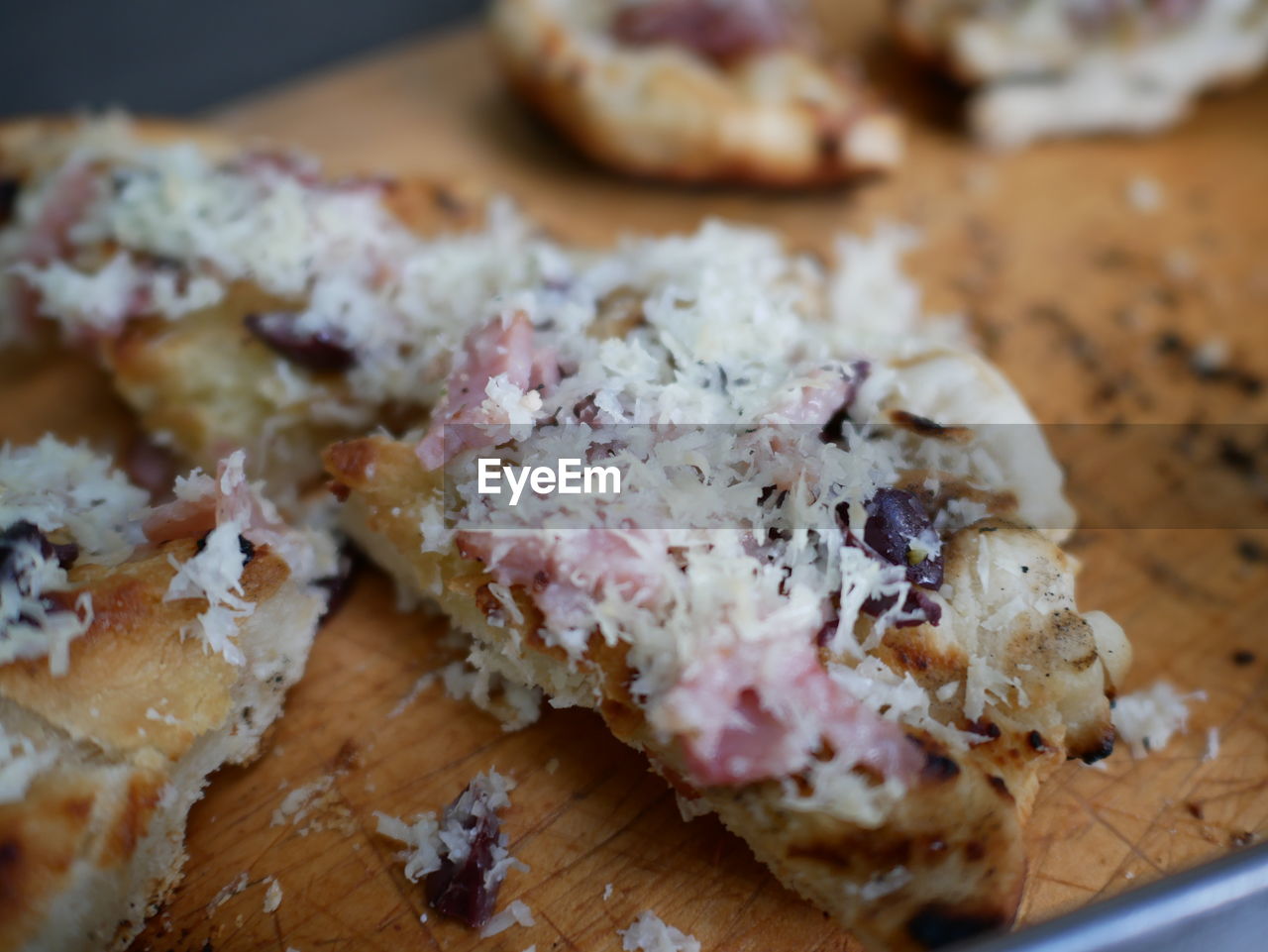 Close-up of pizza slices on cutting board