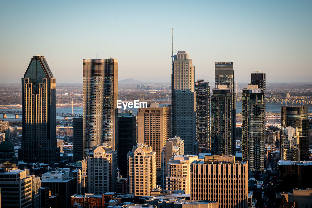 Modern buildings in city against sky