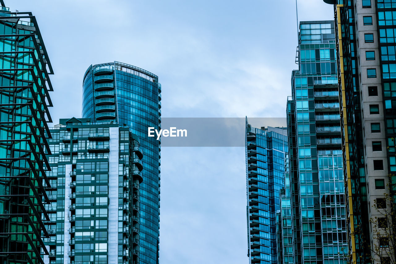 Low angle view of modern buildings against sky