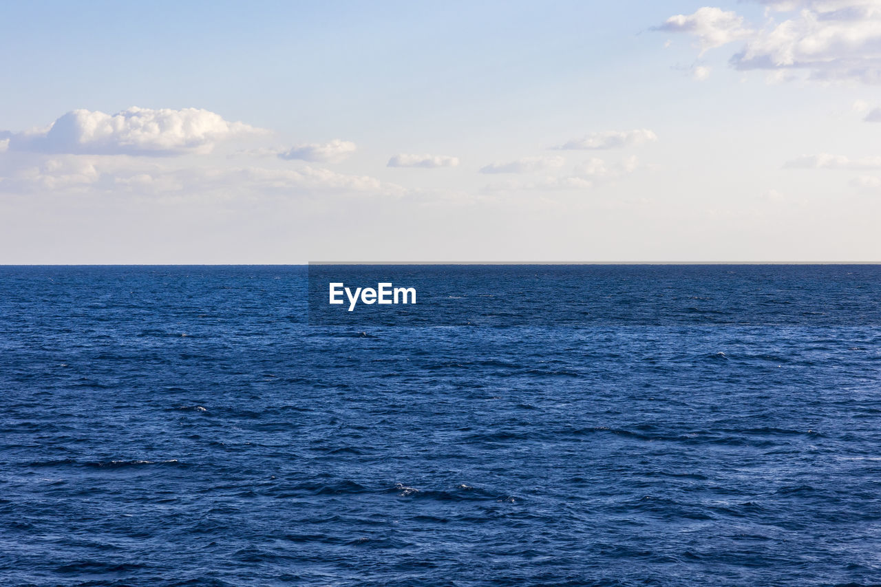 SCENIC VIEW OF SEA AGAINST BLUE SKY