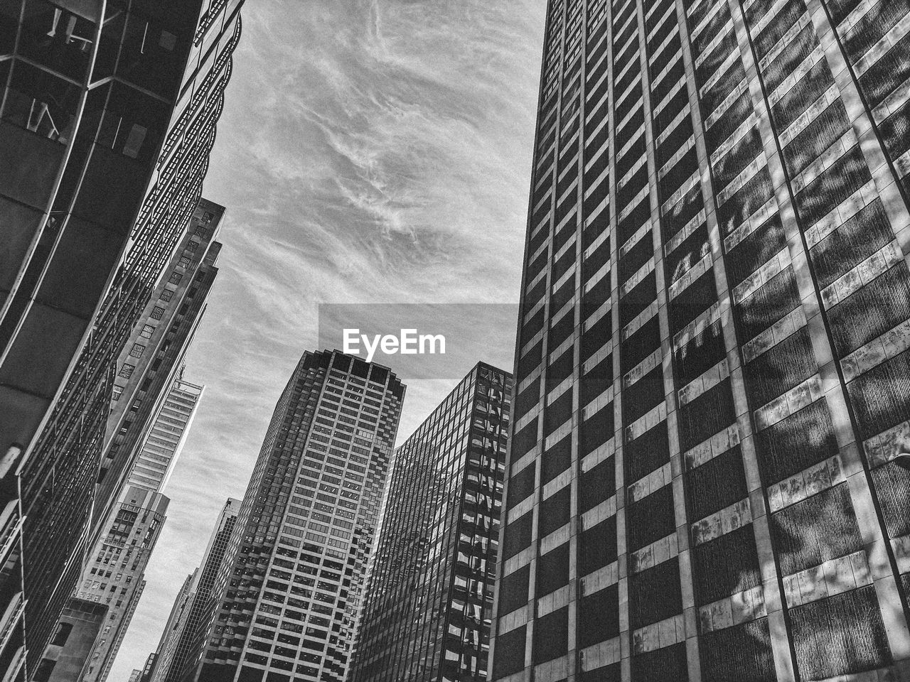 Low angle view of modern buildings against sky