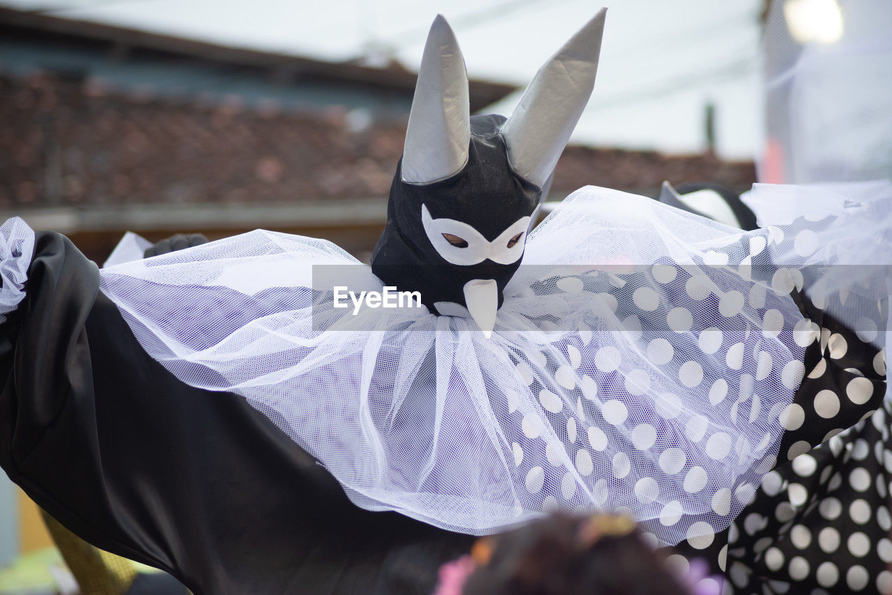 People wearing venetian carnival-style masks are seen during the carnival 