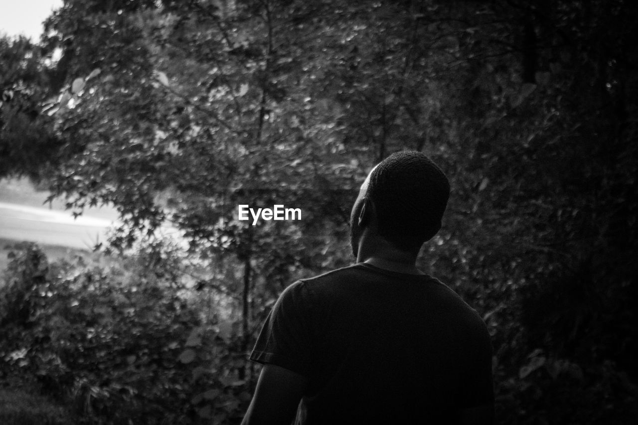 LOW SECTION OF MAN STANDING OUTDOORS