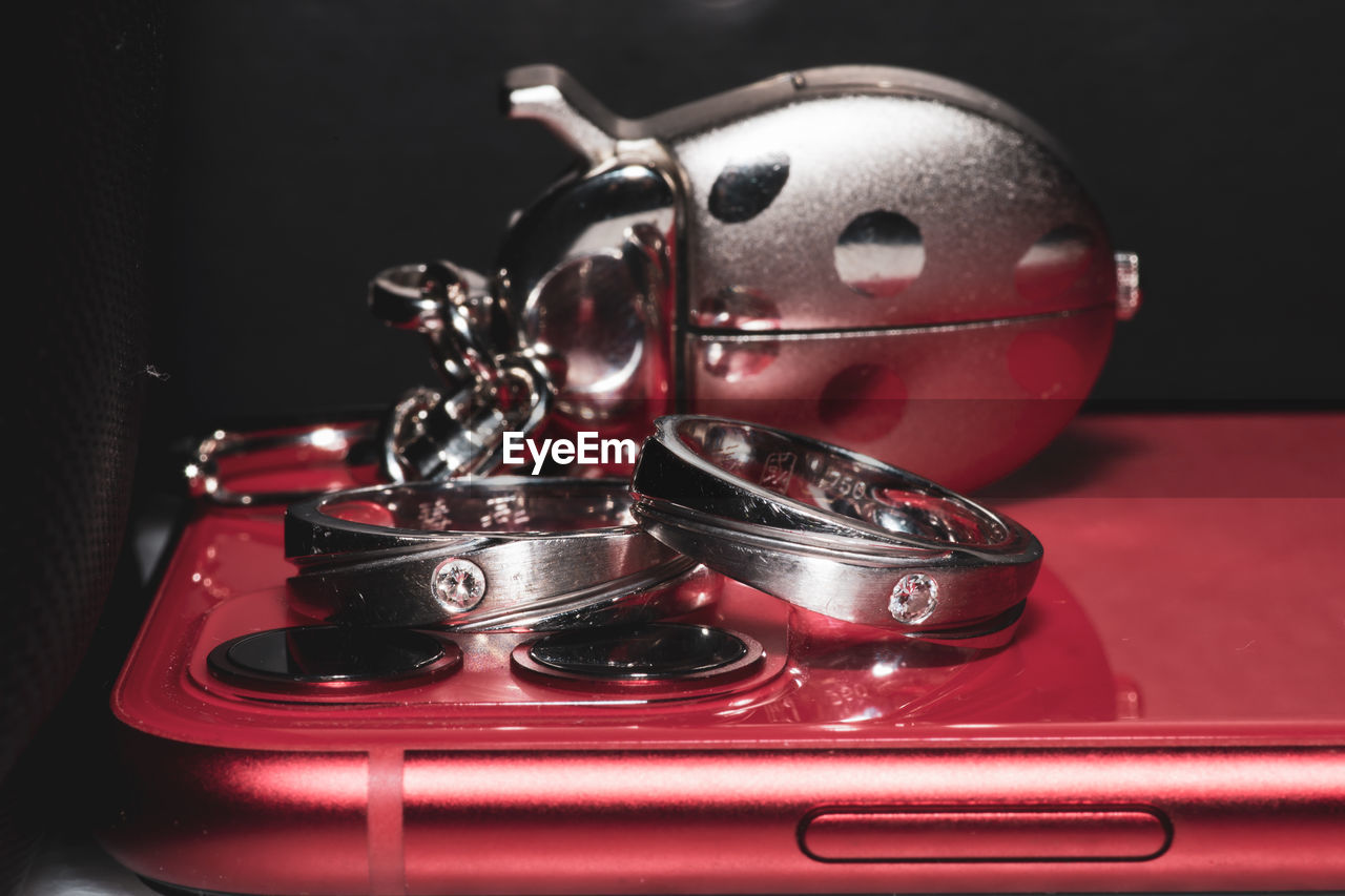 Close-up of engagement rings on phone