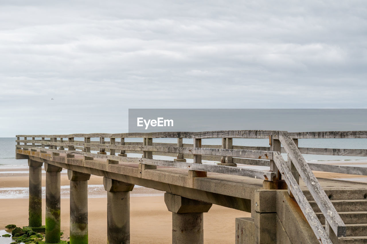 Bridge over sea against sky