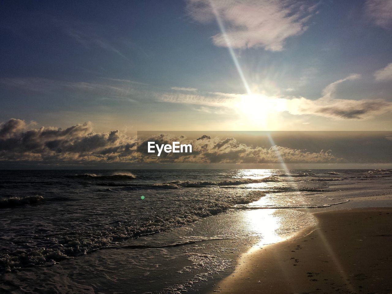 Scenic view of sea against sky at sunset