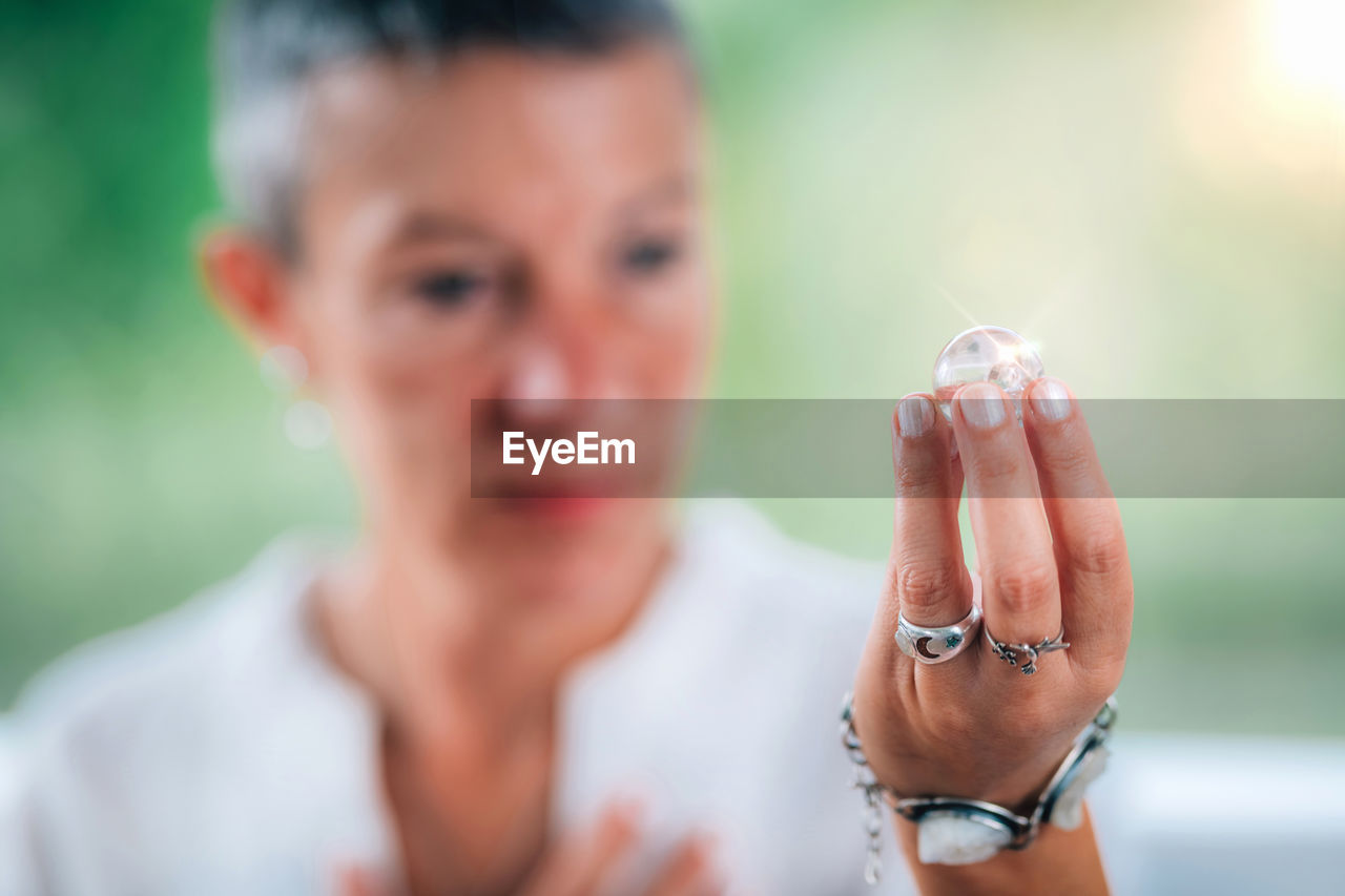 Spiritually enlightened person focused on a crystal pearl