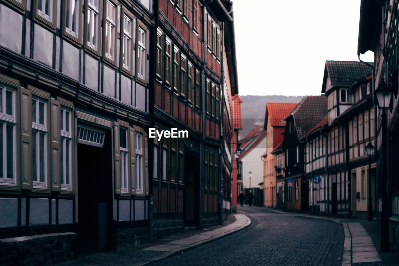 Street amidst buildings against sky