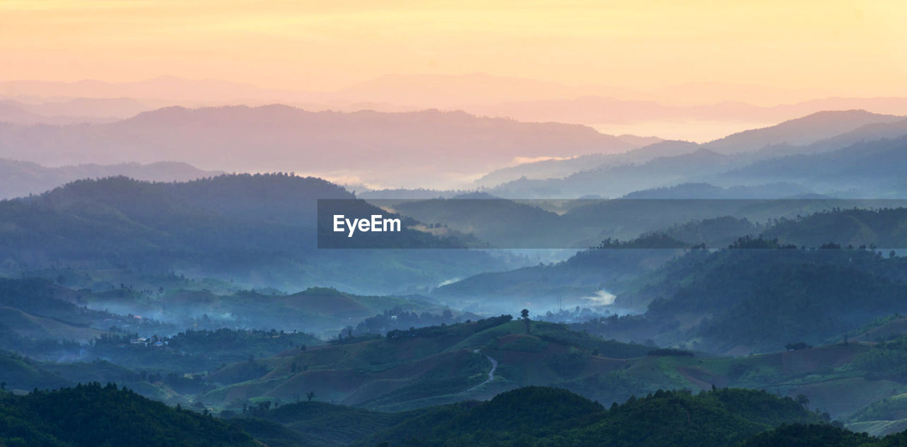 Scenic view of mountains against sky during sunset