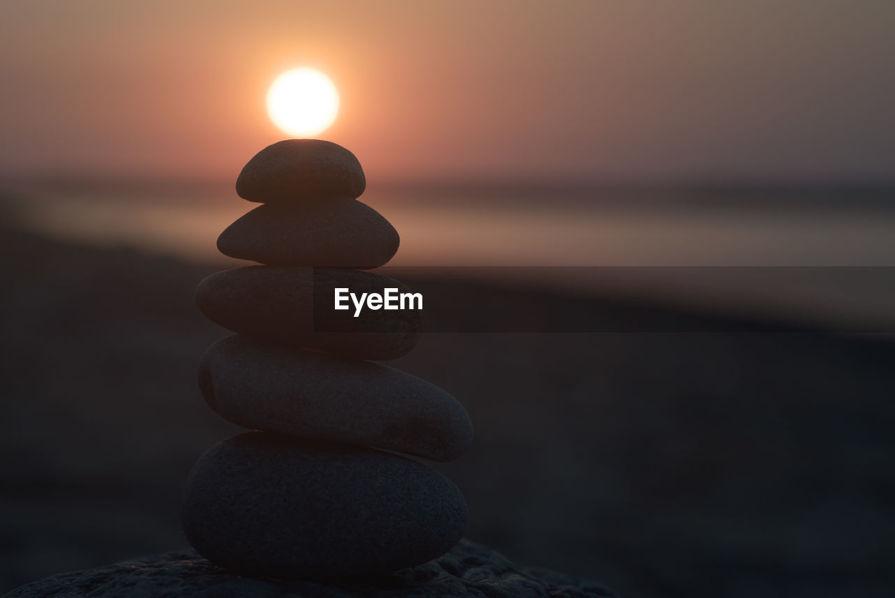 STACK OF STONES AT BEACH