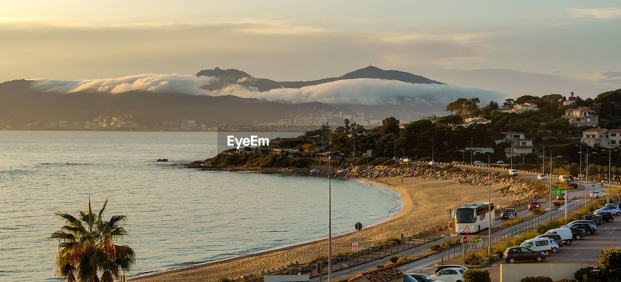 HIGH ANGLE VIEW OF CITY AT SEASIDE