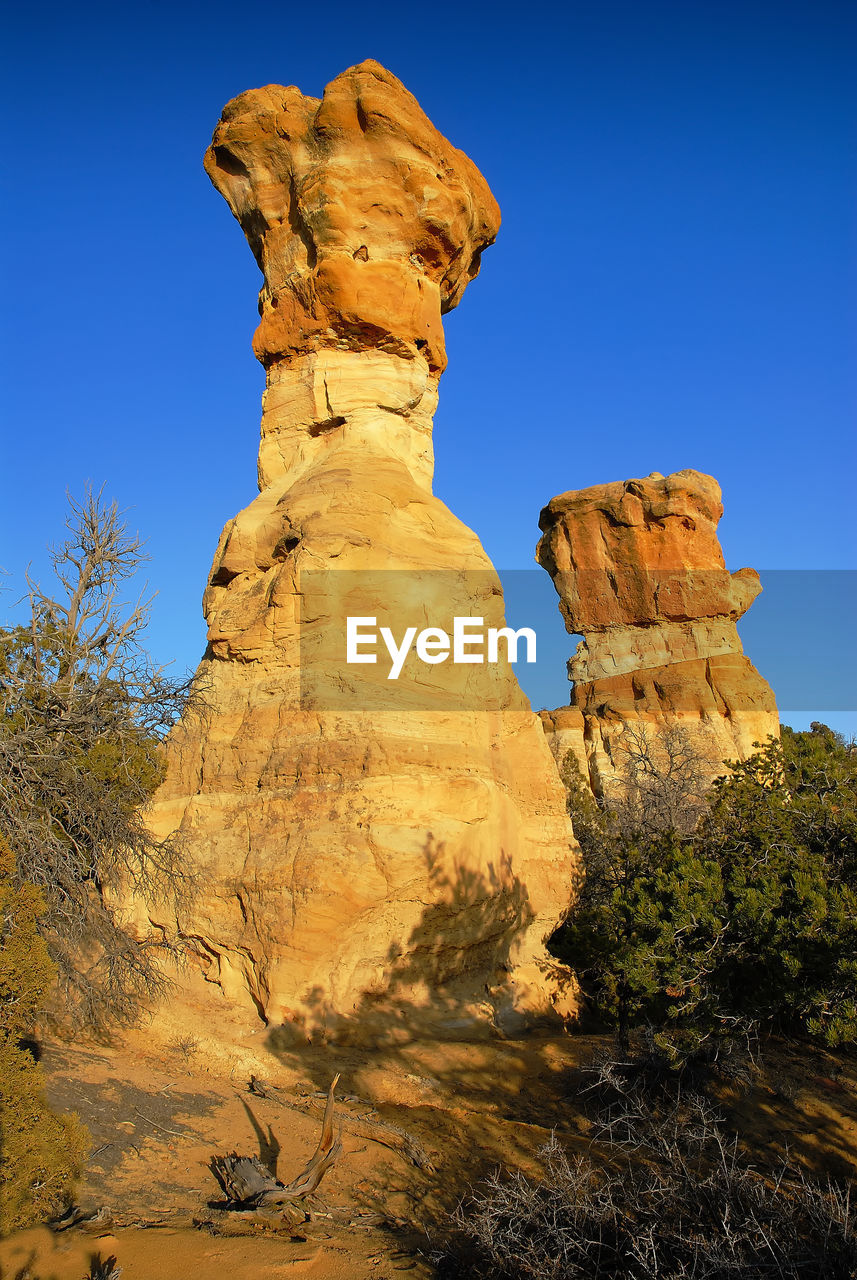 Rock hoodoo against clear sky