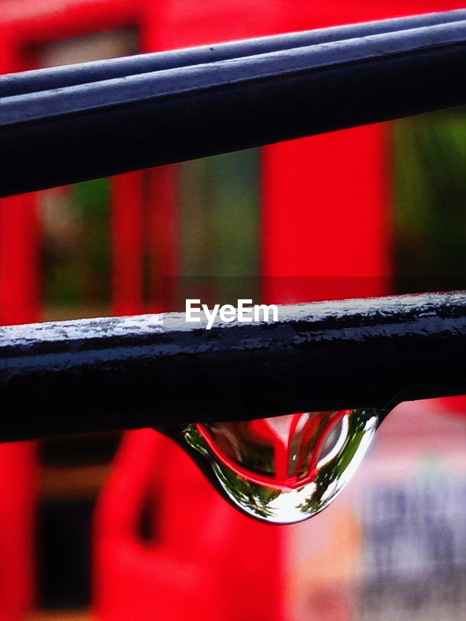CLOSE-UP OF WATER ON RED OUTDOORS